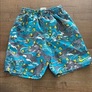 Nike Blue and Gray with yellow swoosh boys swim trunks, lined, size Med.